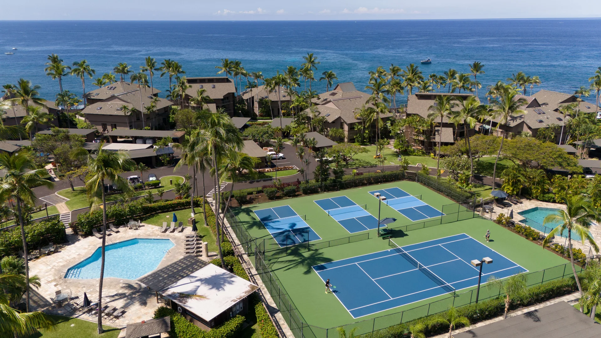 Resort overview with tennis courts and pools