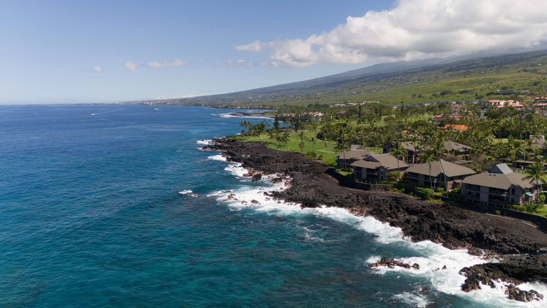 Kona coastline aerial with Hualalai in the distance