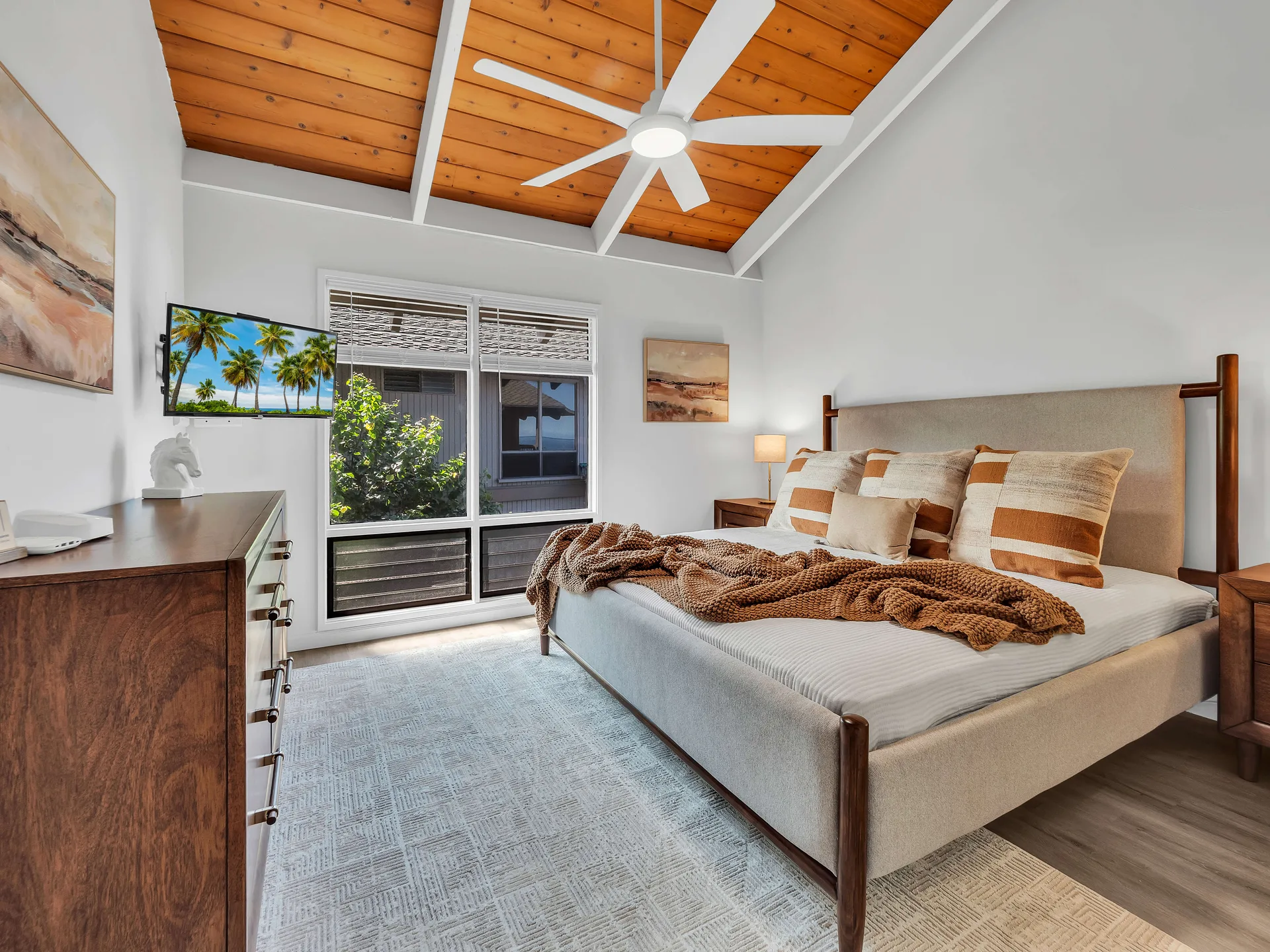 Second bedroom with art and dresser