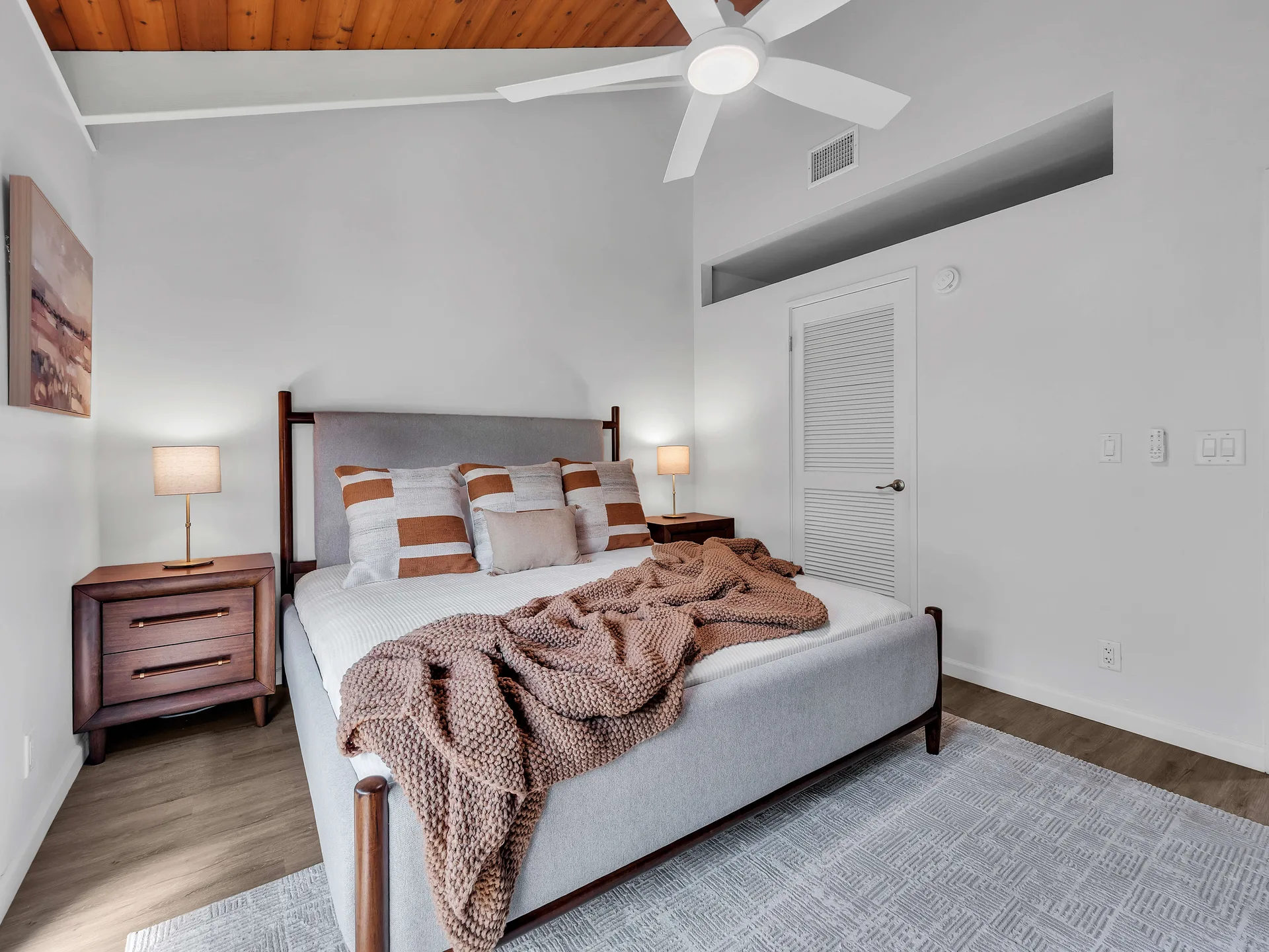 Second bedroom with king bed and vaulted ceiling