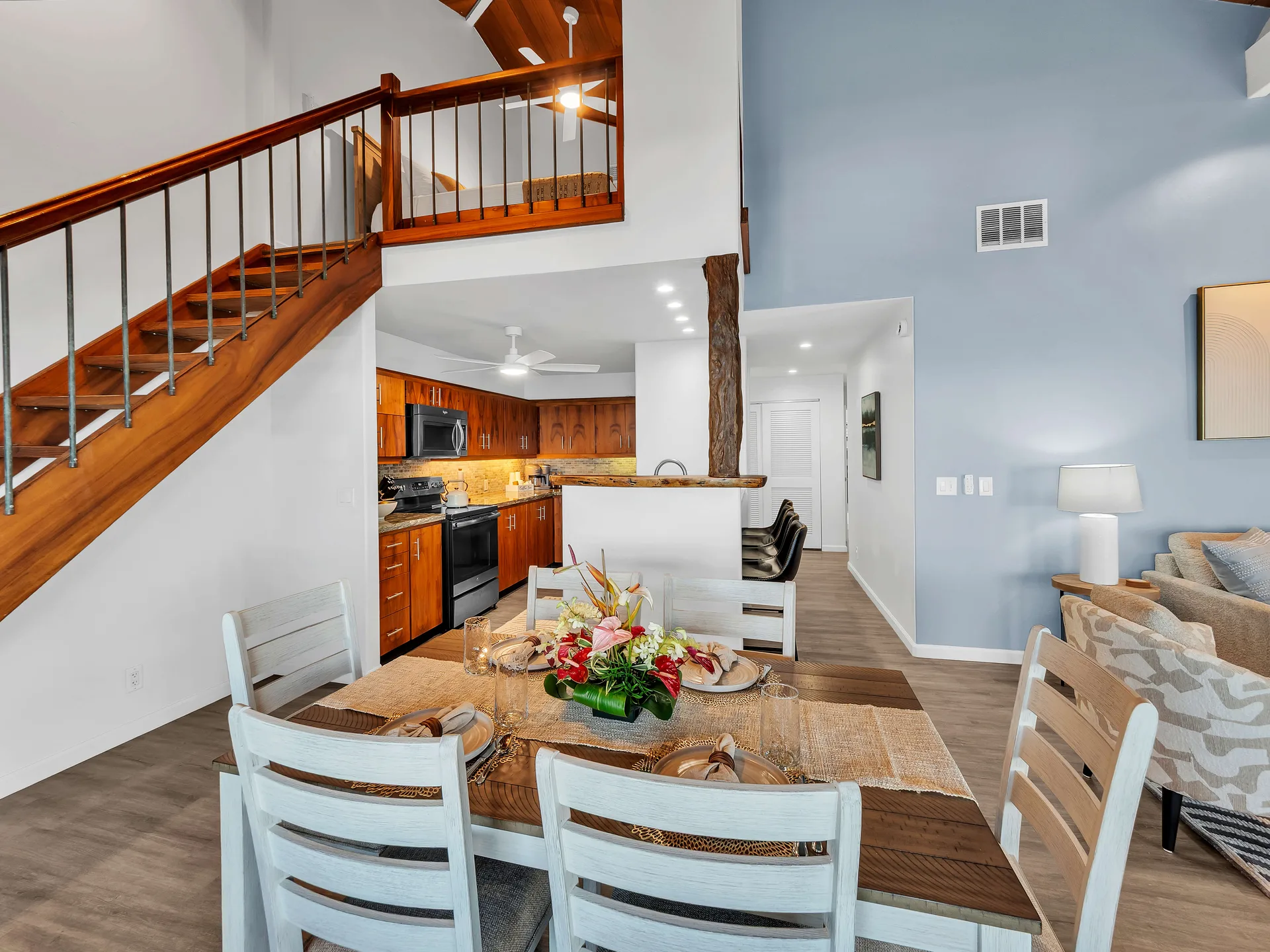 Dining area with staircase and open-concept layout