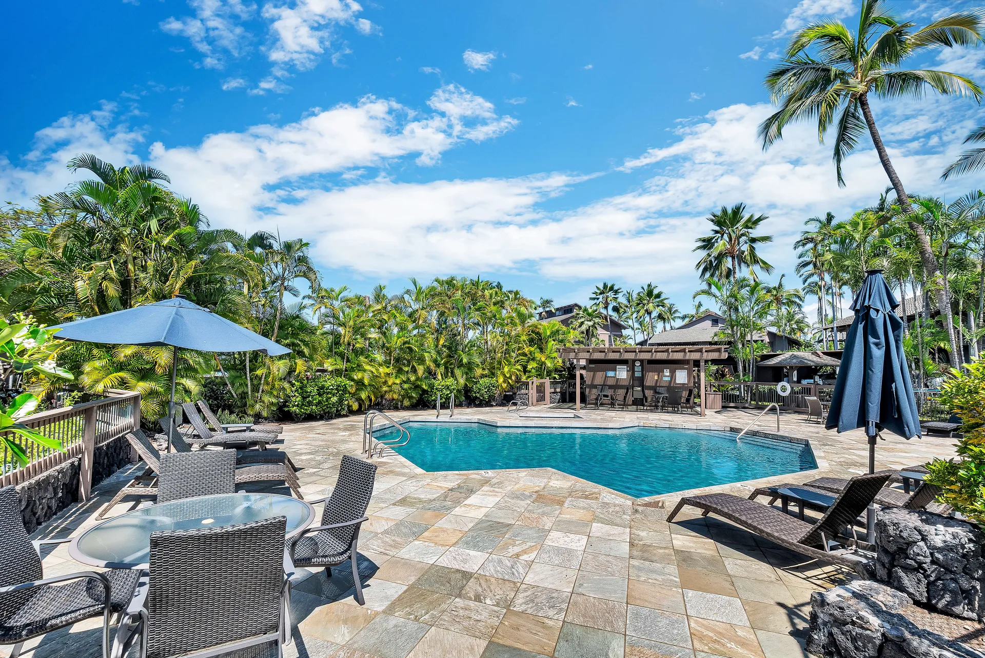 Resort pool with lounge chairs and cabana