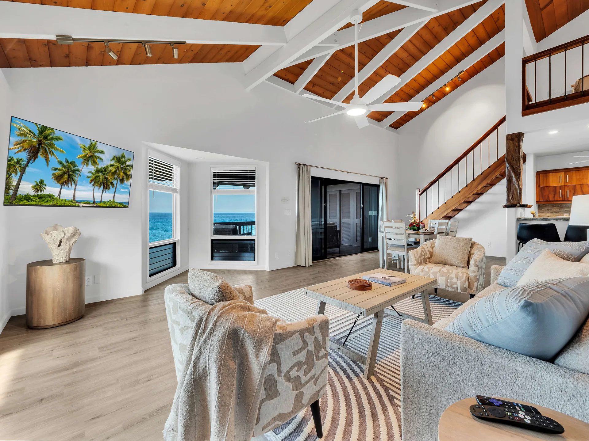 Living room with vaulted wood ceiling and ocean views